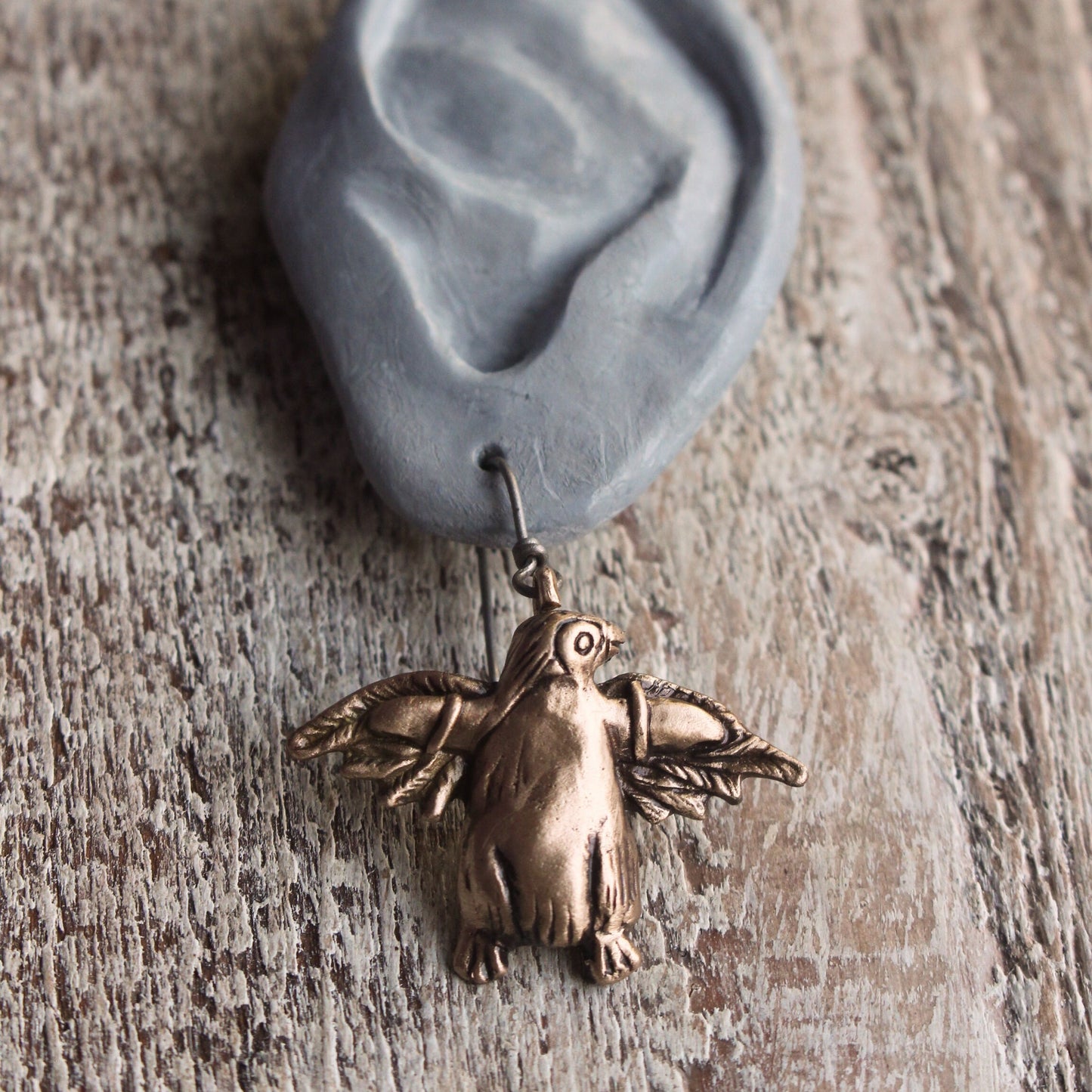 Dangling bronze penguin earrings with  titanium ear hooks
