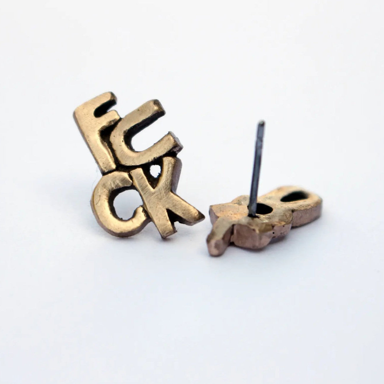 earrings in bronze and titanium that say fuck you