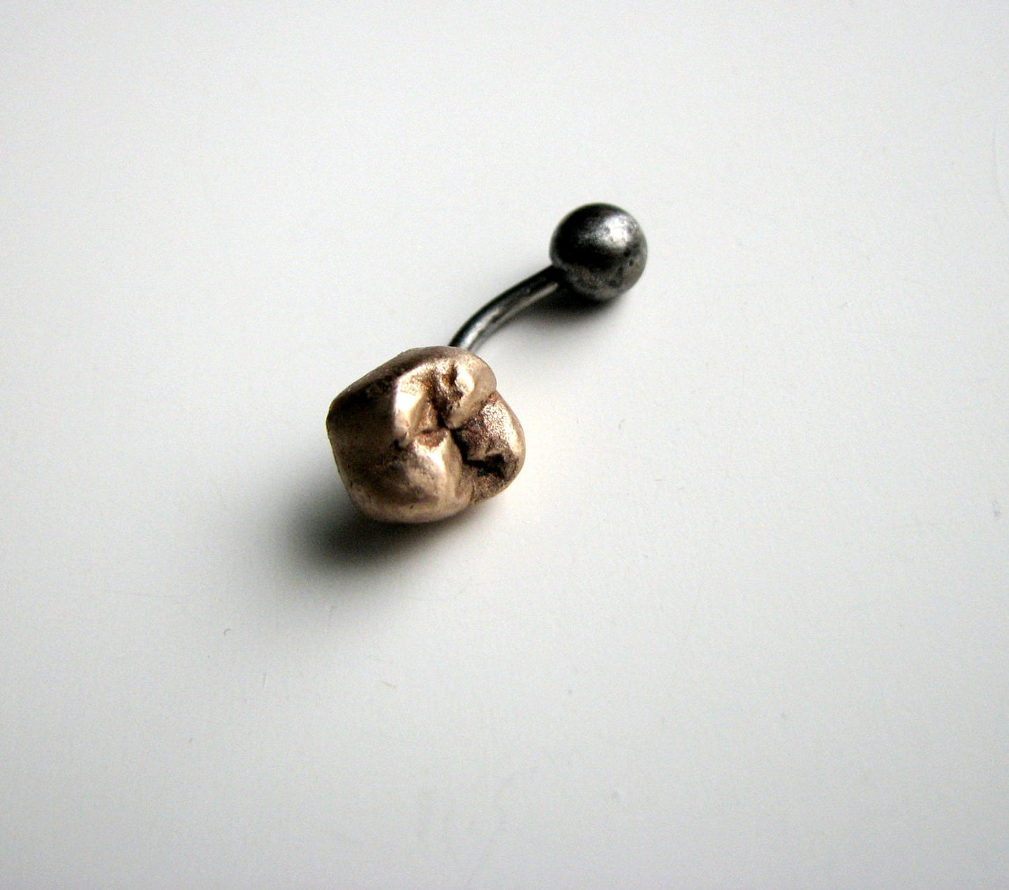 Guldtand navelsmycke