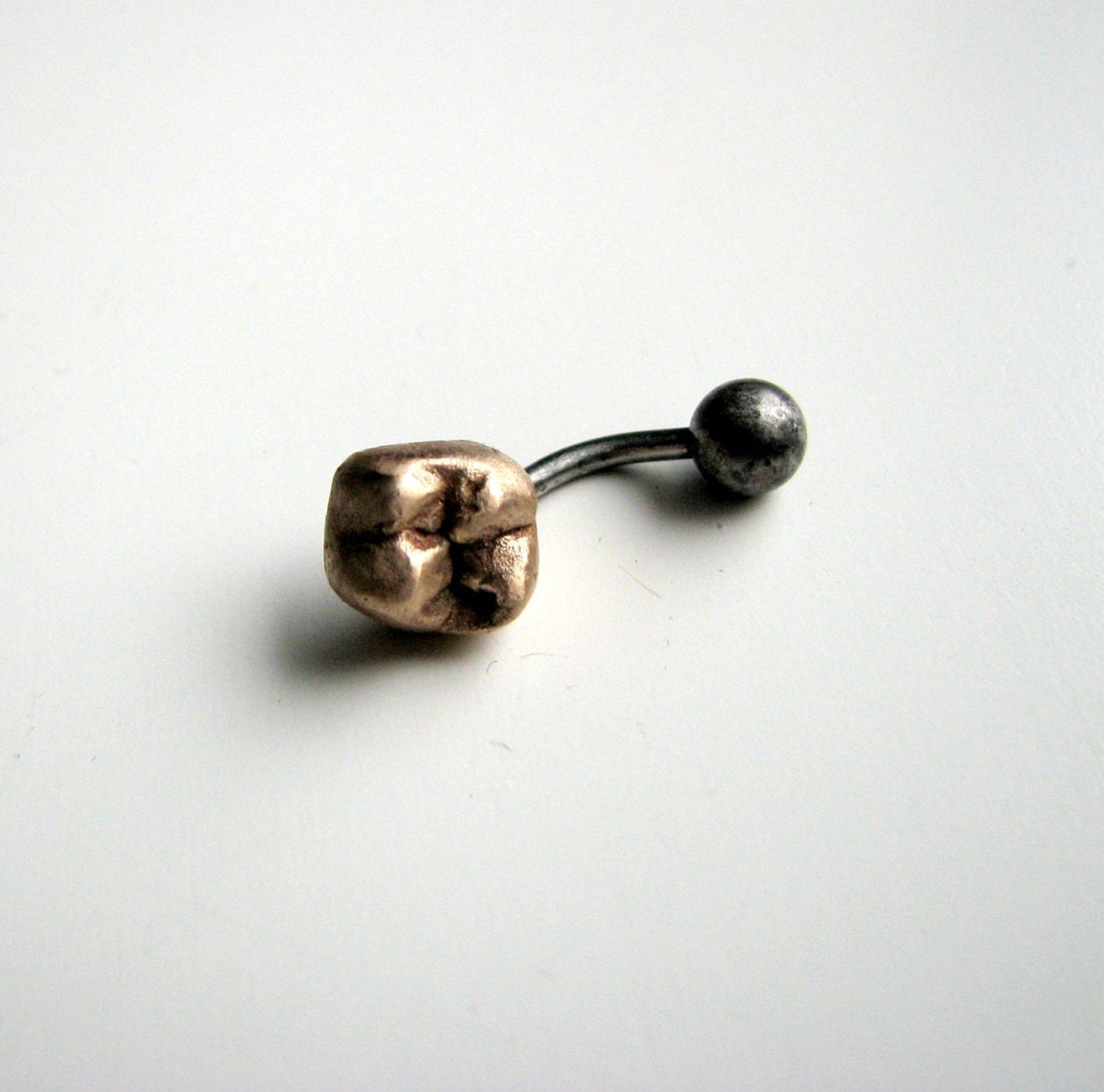 Guldtand navelsmycke