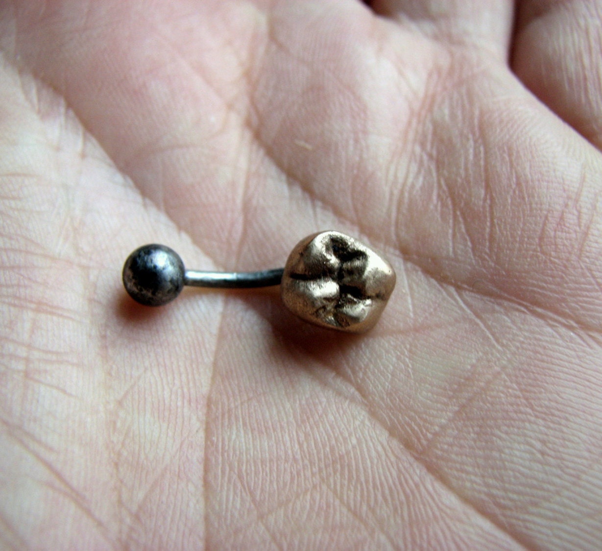 Guldtand navelsmycke