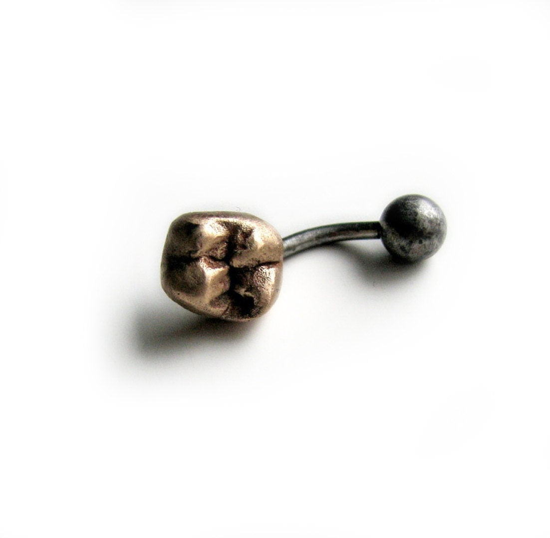 Guldtand navelsmycke