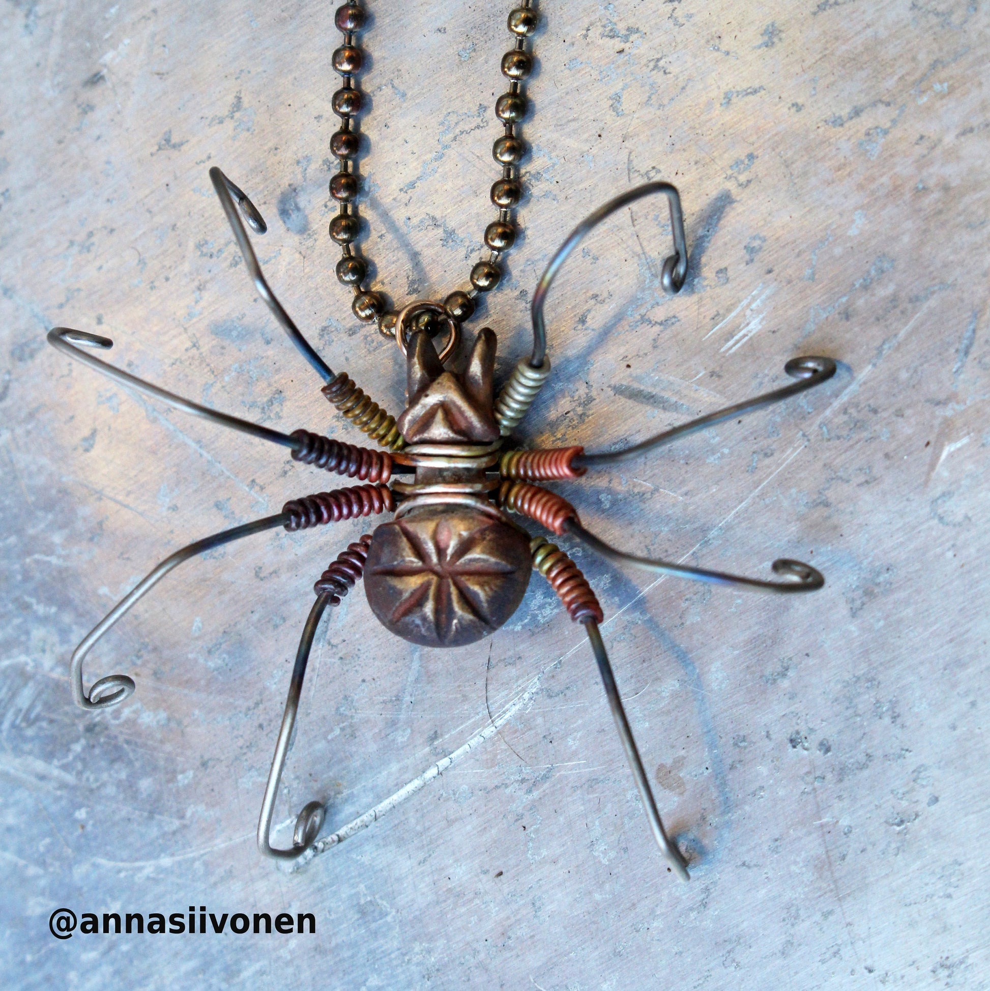 wire wrapped spider necklace in bronze, silver, titanium