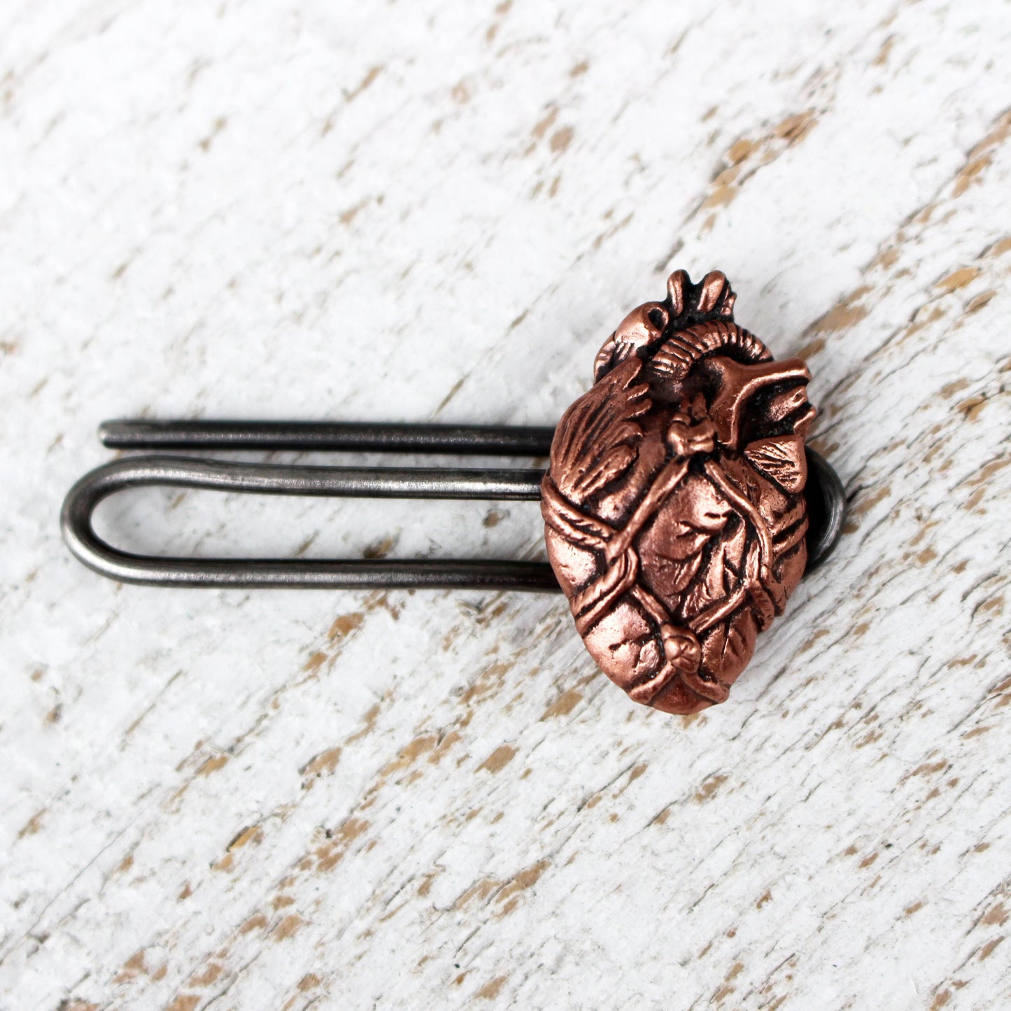 Bound anatomical heart slipsklämma