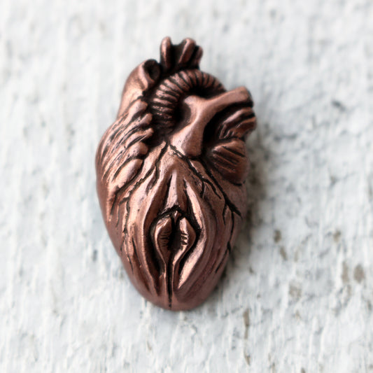 anatomical heart and vulva hybrid necklace made from copper and bronze
