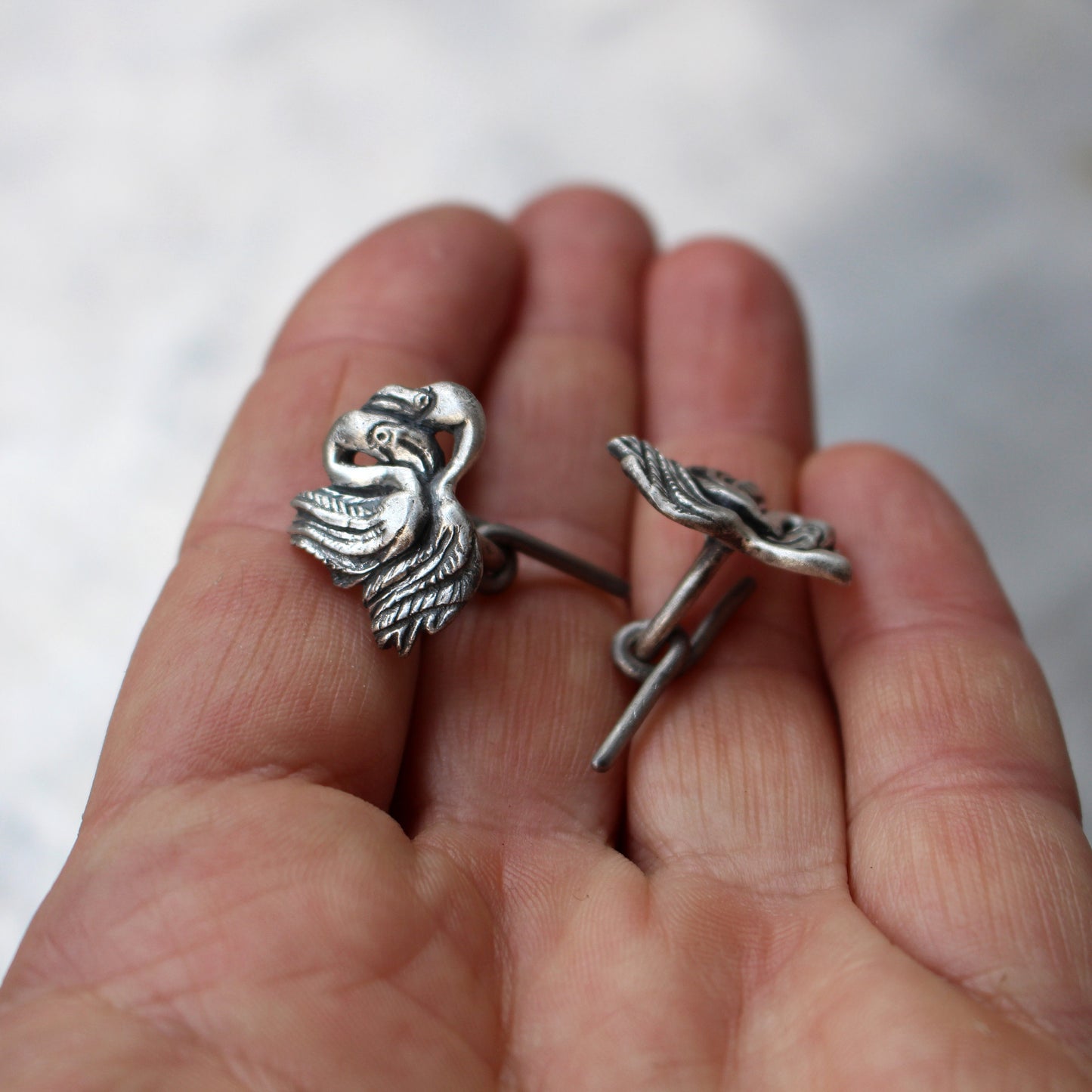 cuff links with flamingoes