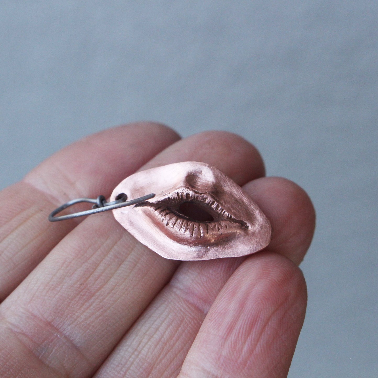 Vändbara vagina och mun örhängen