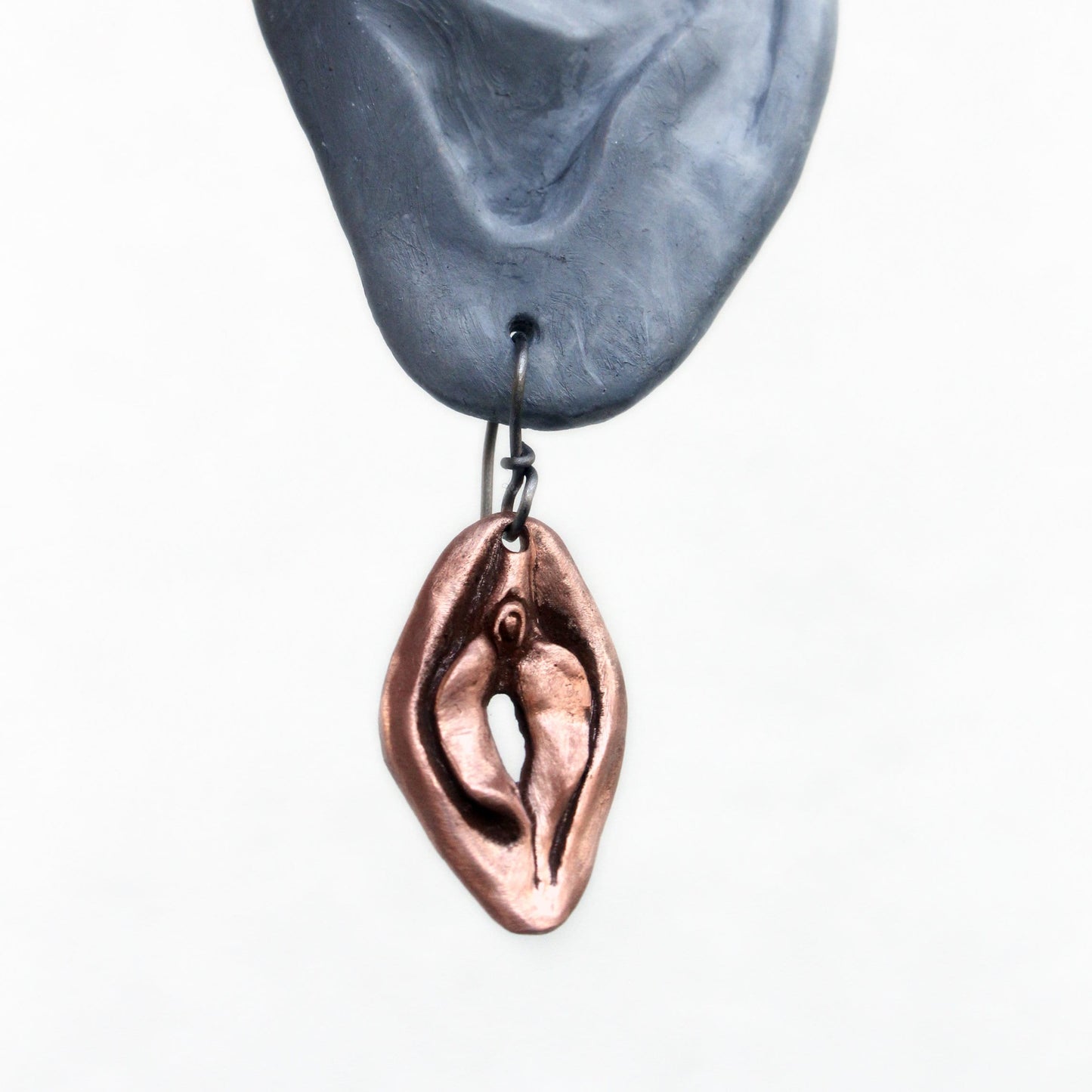 Vändbara vagina och mun örhängen