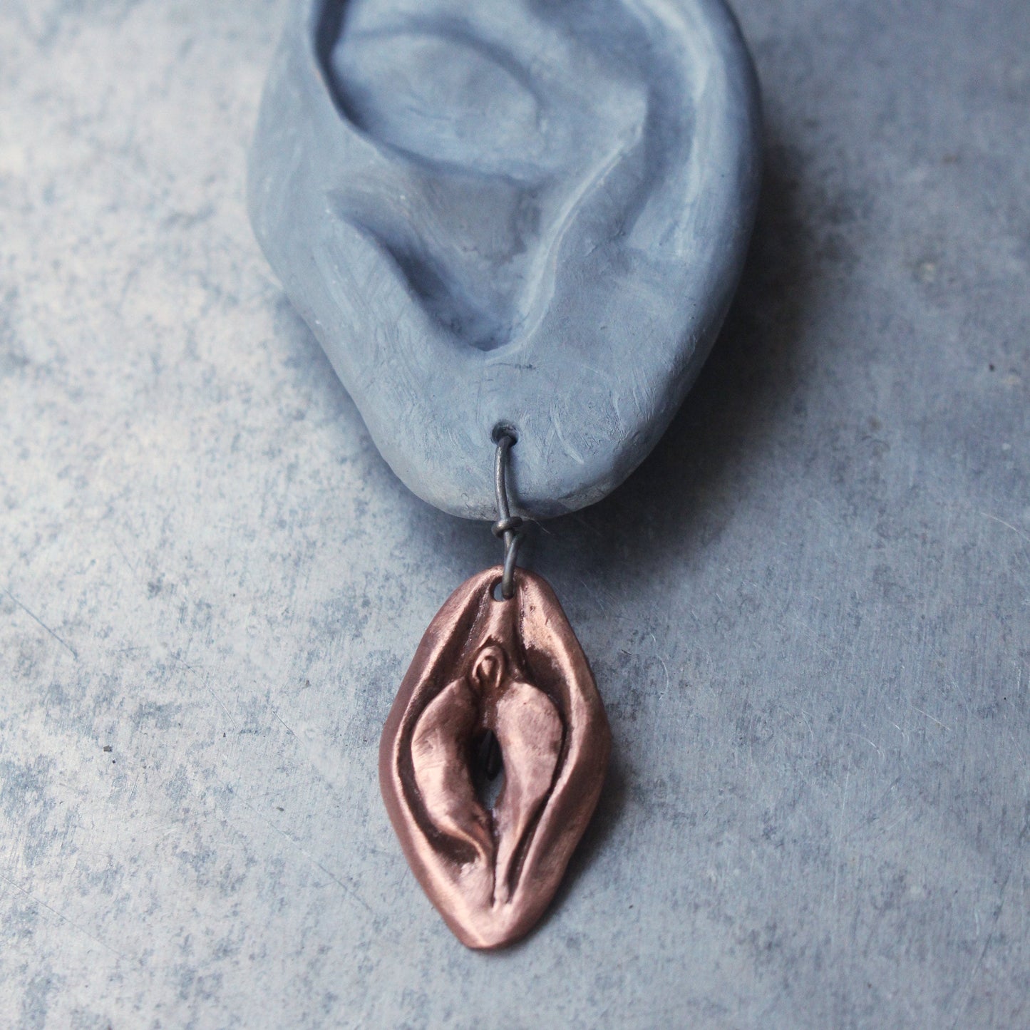 Vändbara vagina och mun örhängen