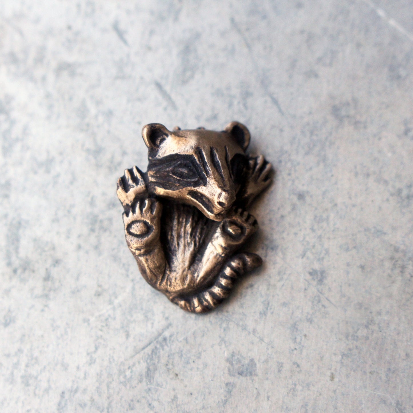 Baby raccoon pendant