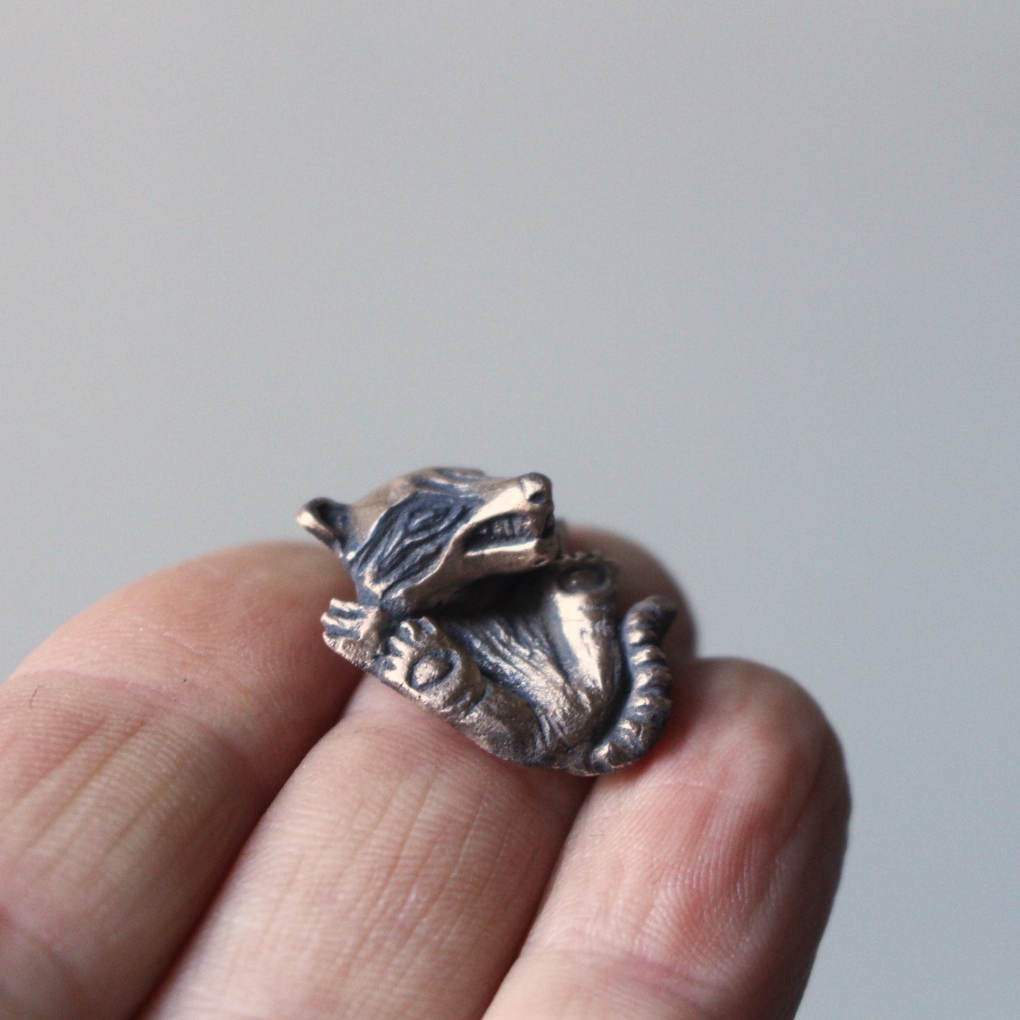 Baby raccoon pendant