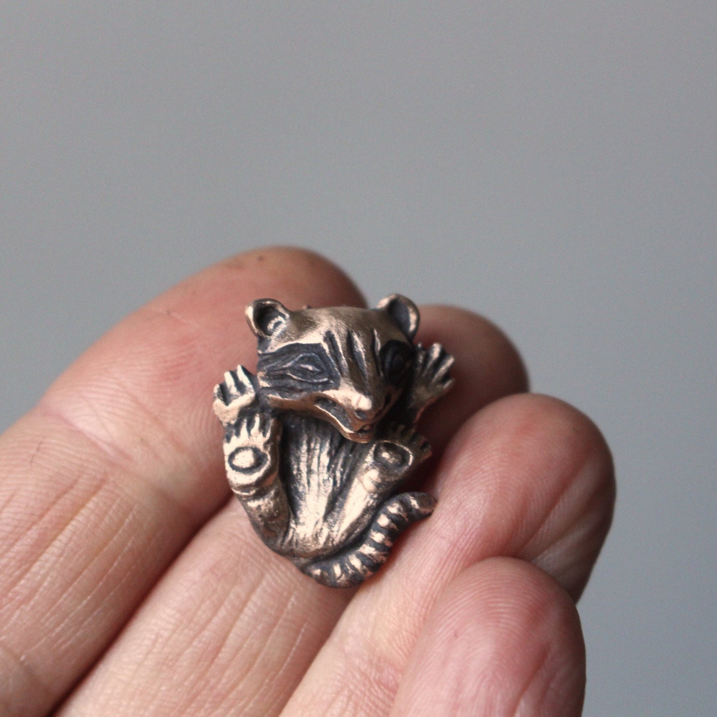 Baby raccoon pendant