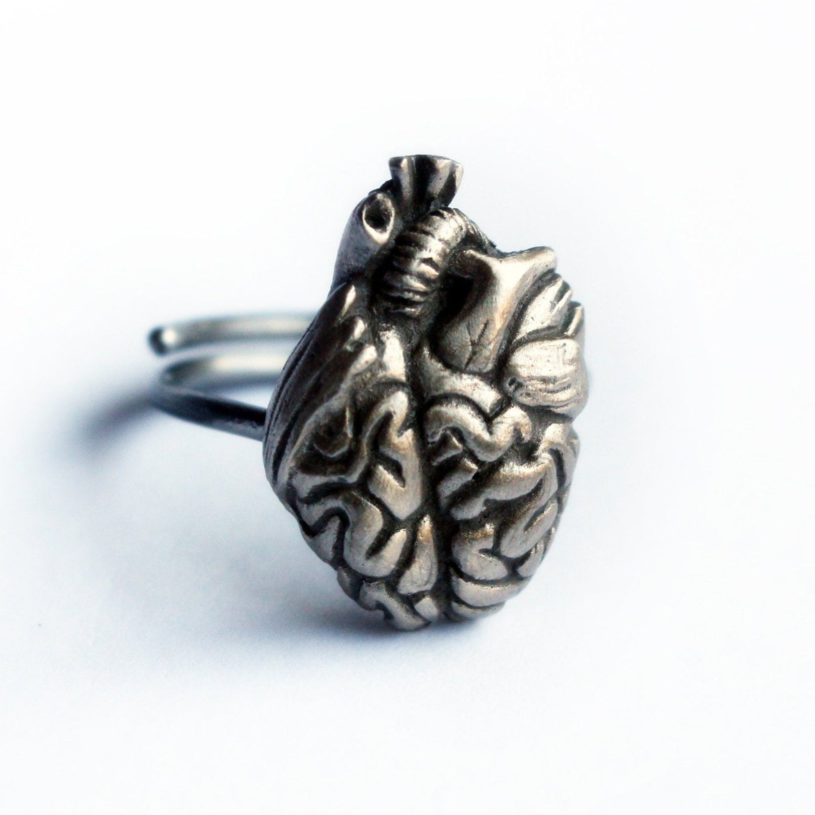 ring with a human brain and heart mix sculpture