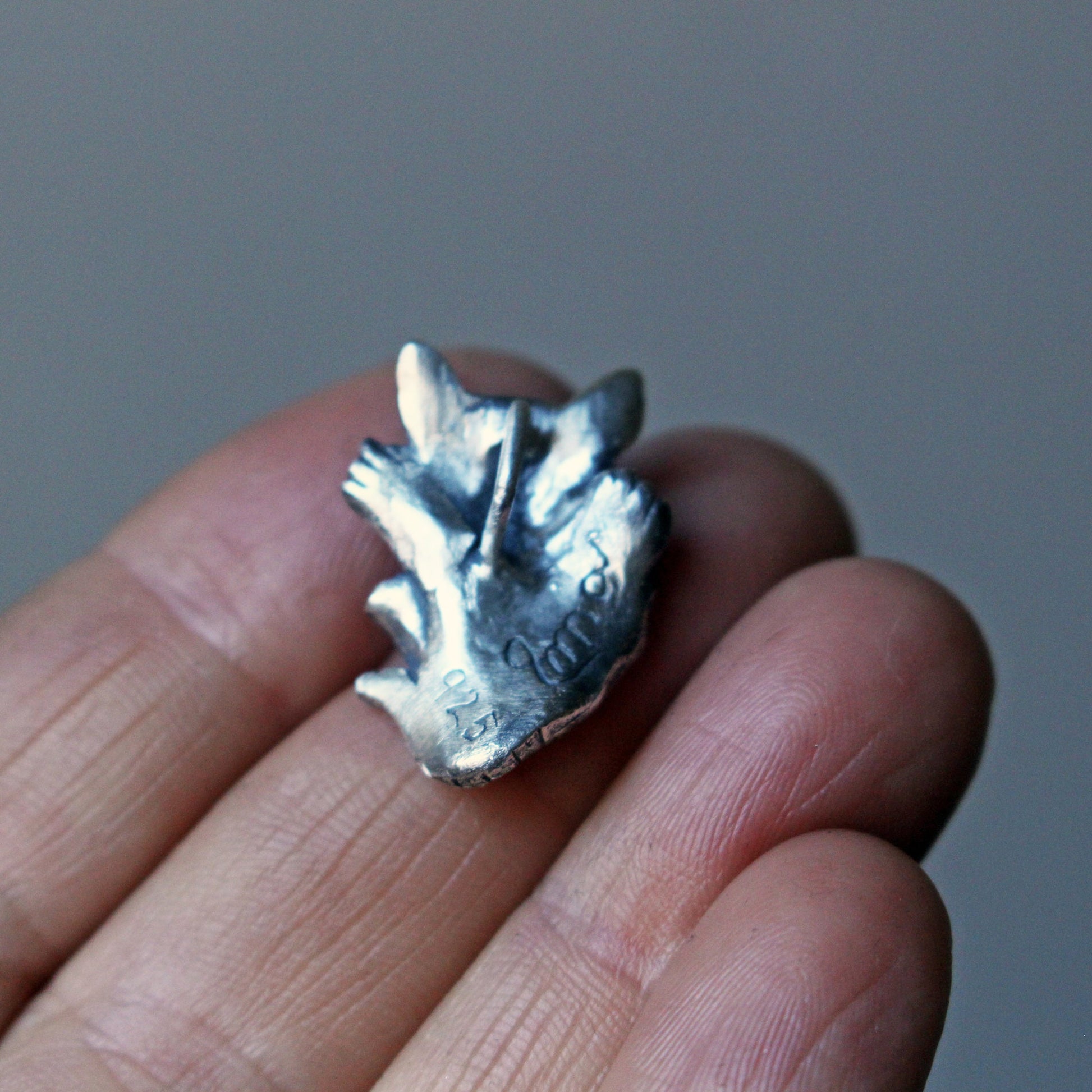 wolf cub pendant backside