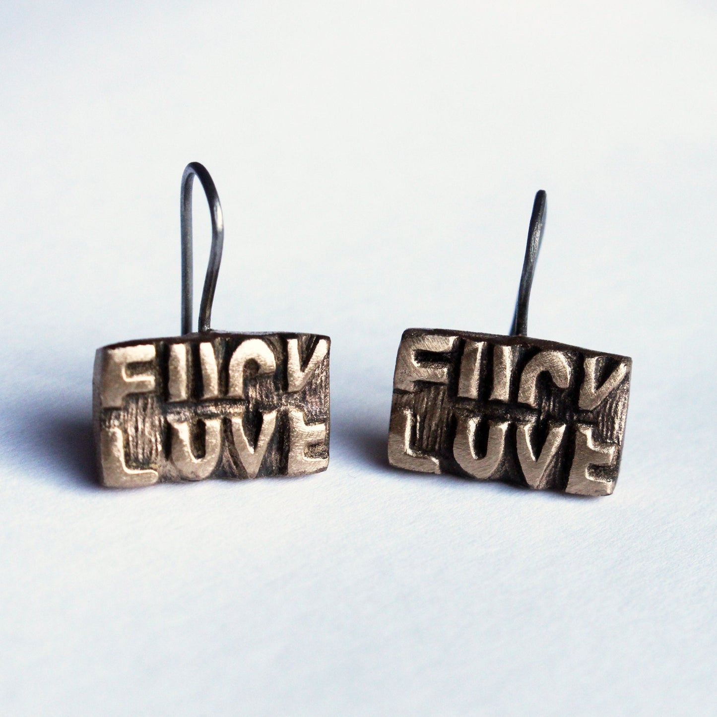 Fuck love earrings