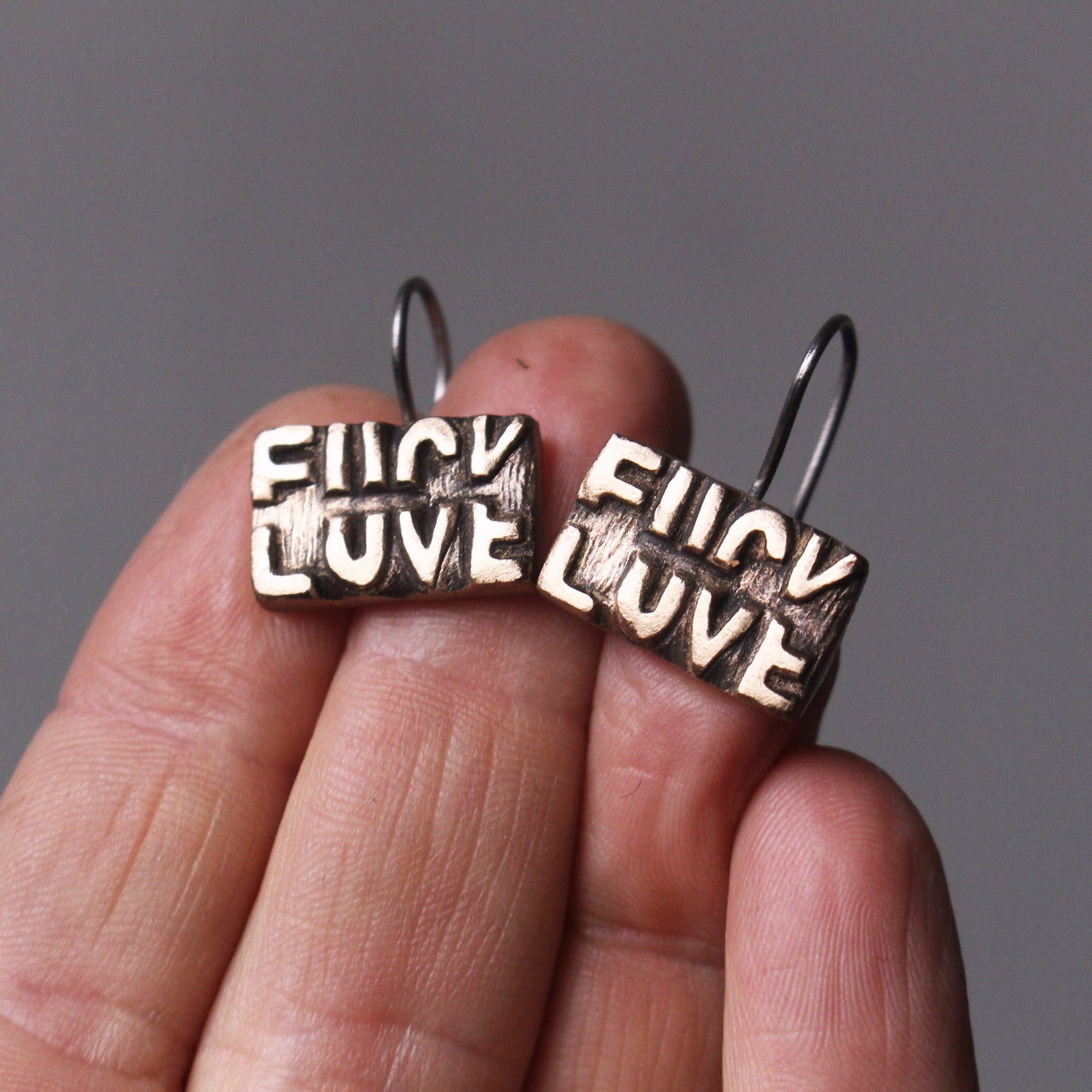 Fuck love earrings