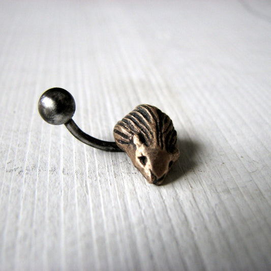 A belly button ring with a hedgehog- in bronze and titanium