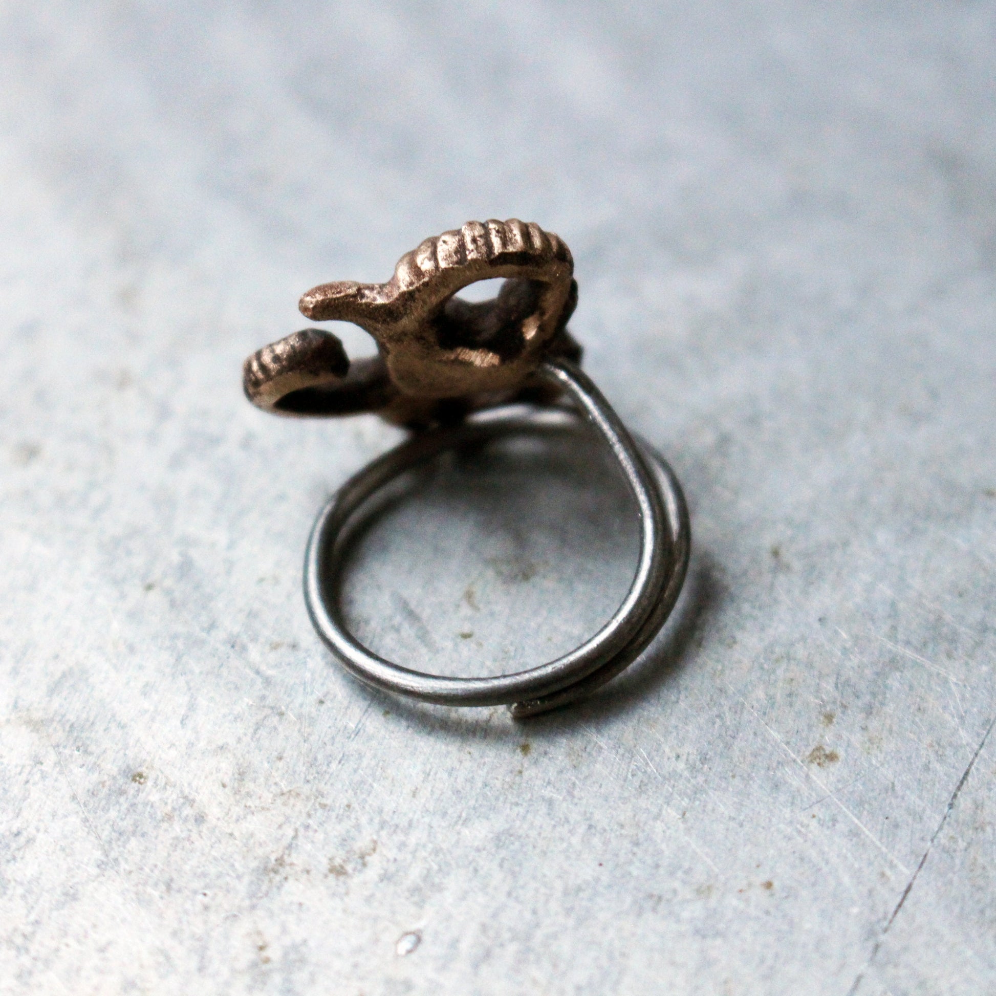 triskelion finger ring in bronze and stainless steel