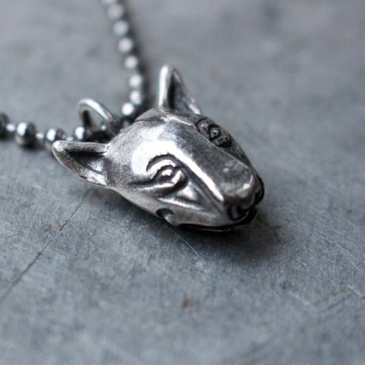 A sterling silver necklace featuring a detailed bull terrier dog head pendant on a chain.