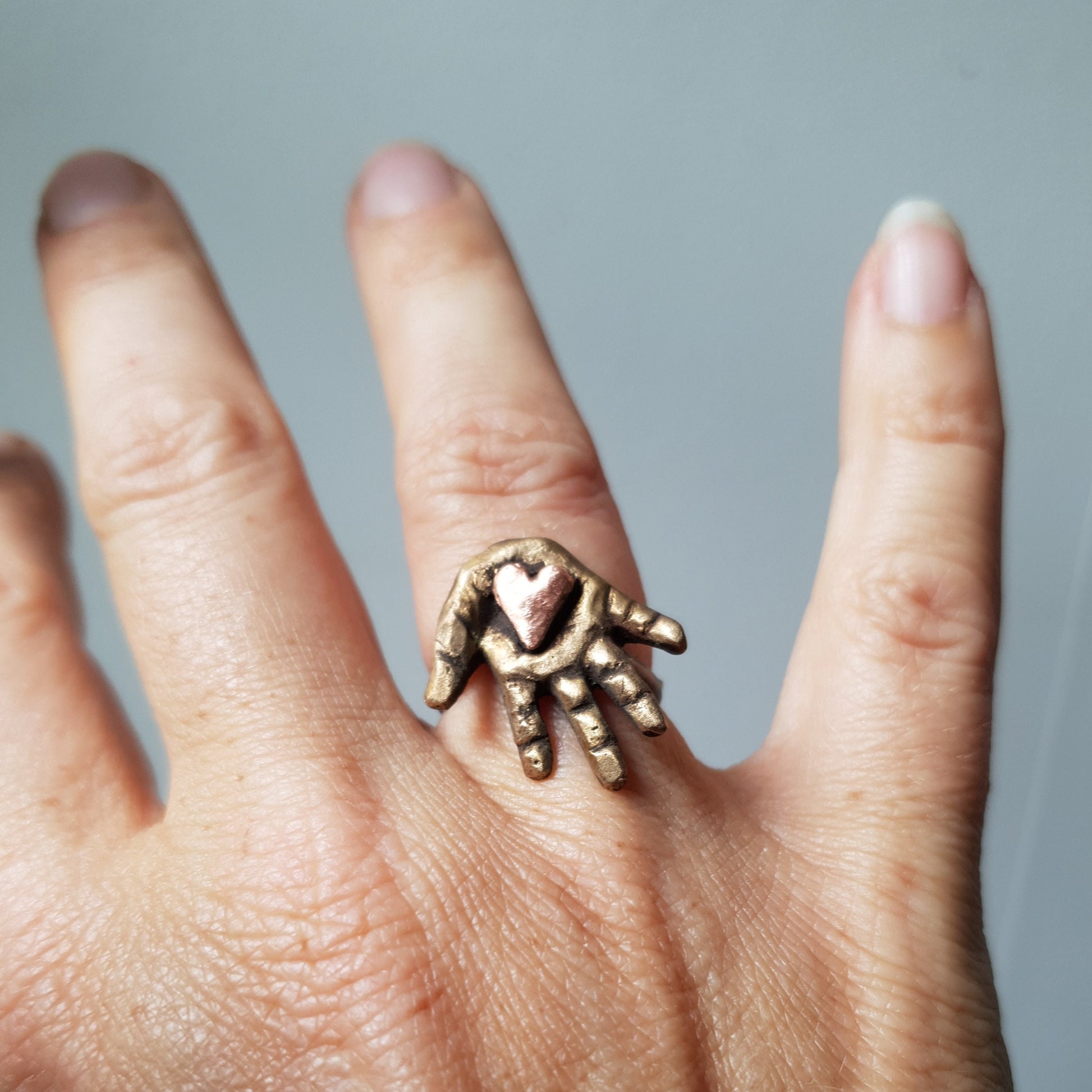 heart in hand finger ring