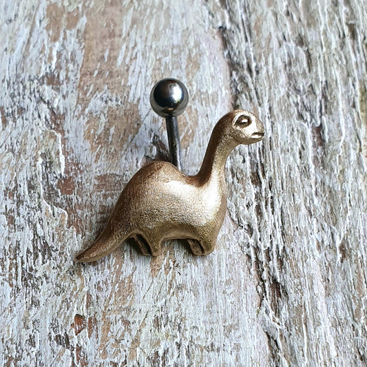 A bronze brachiosaurus dinosaur belly ring with titanium barbell