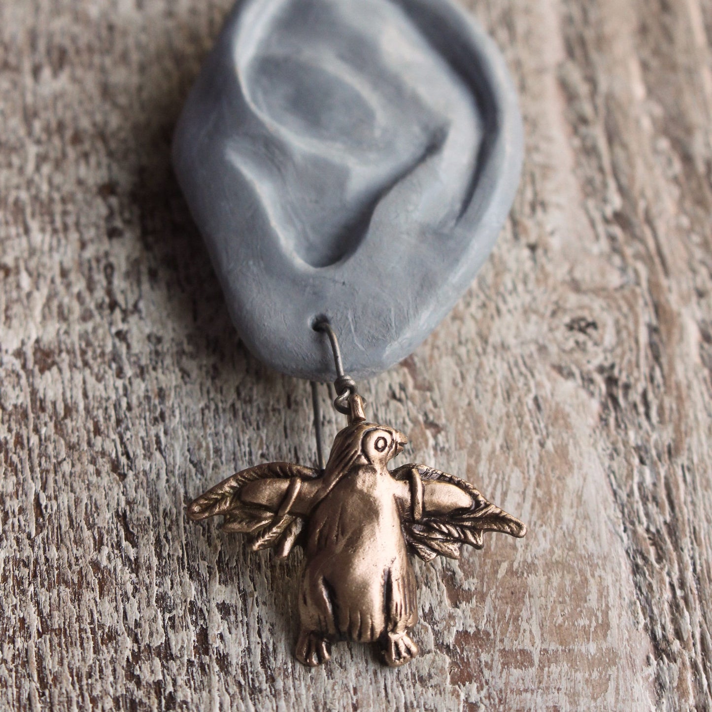 örhängen, pingvin med fågelvingar