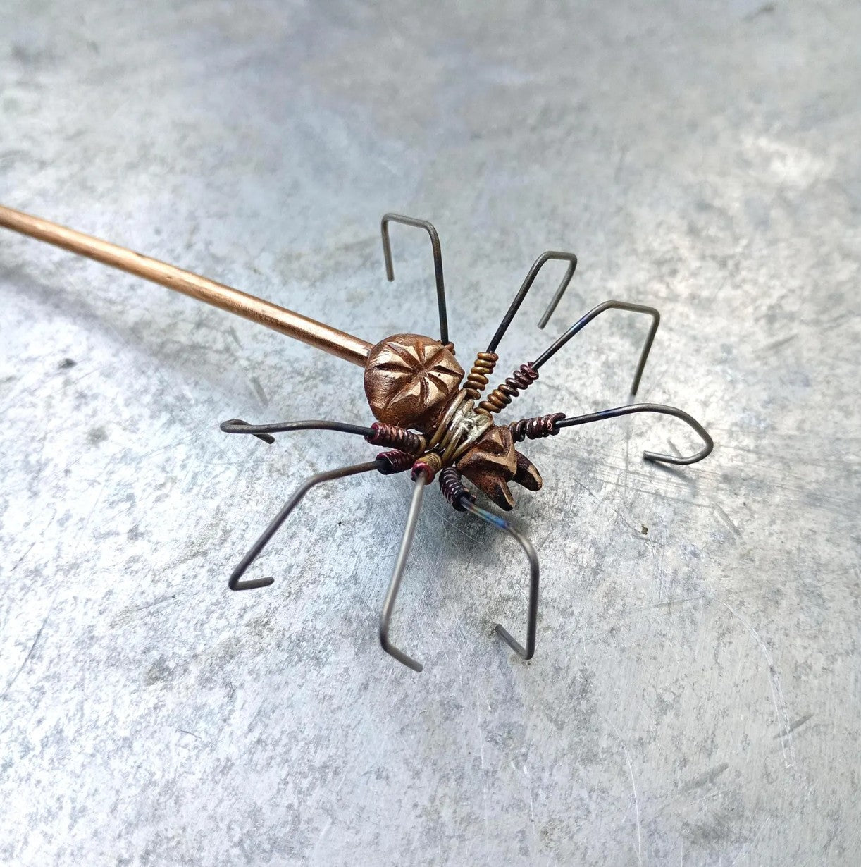 hairjewelry decorated with a wire wrapped spider