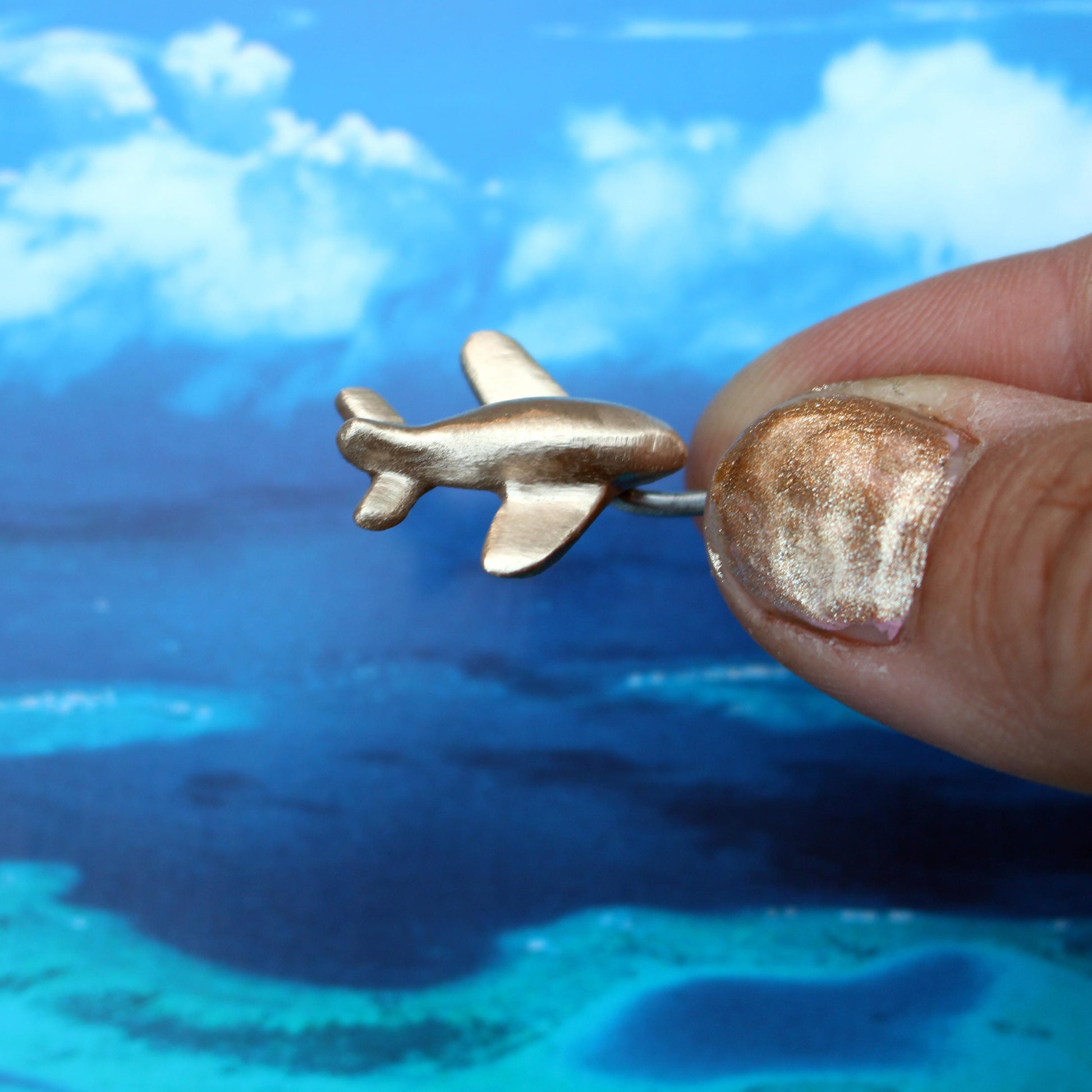 airplane belly button ring iercing jewelry with a small airplane handmade in bronze