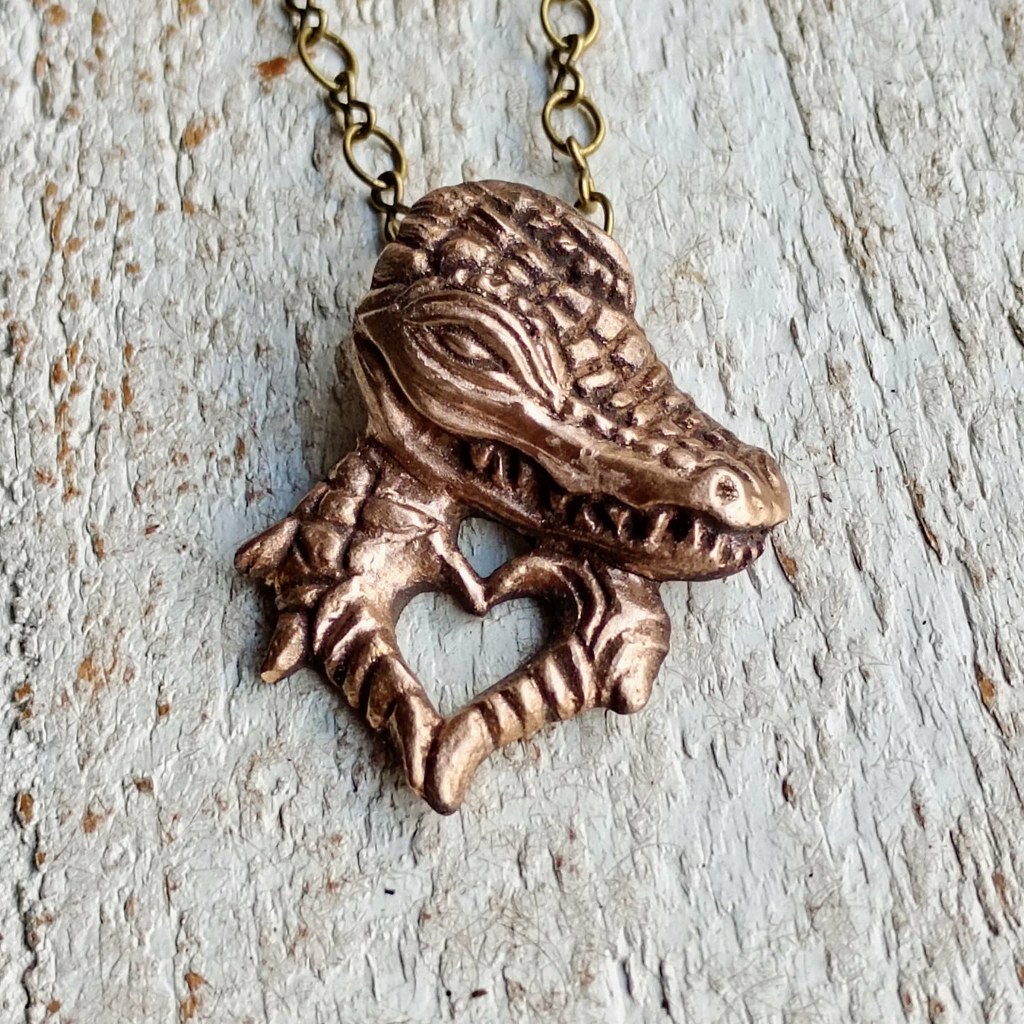 Bronze alligator/crocodile pendant handmade in bronze, the crocodilia makes heart hands