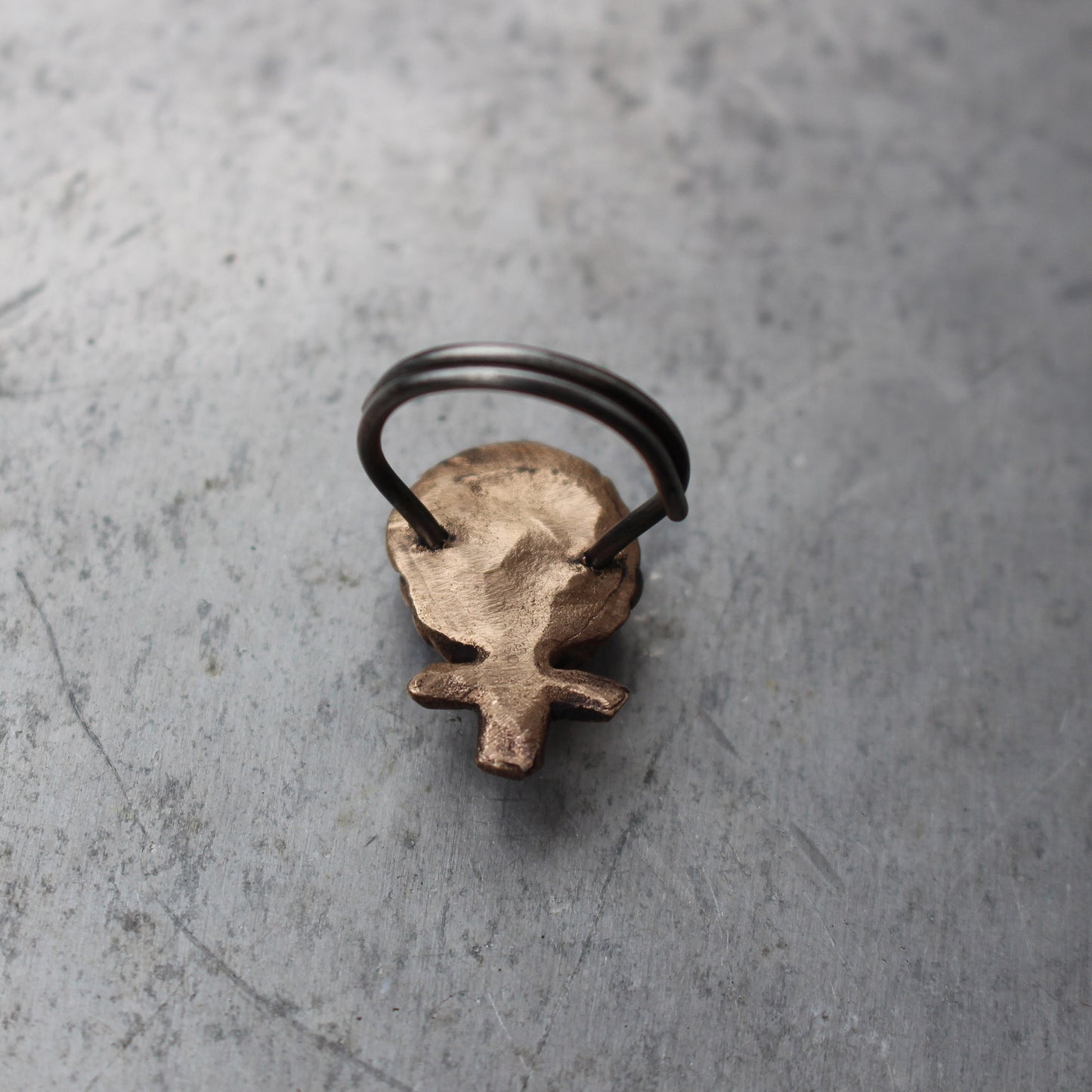 backside feminist adjustable ring in bronze and steel