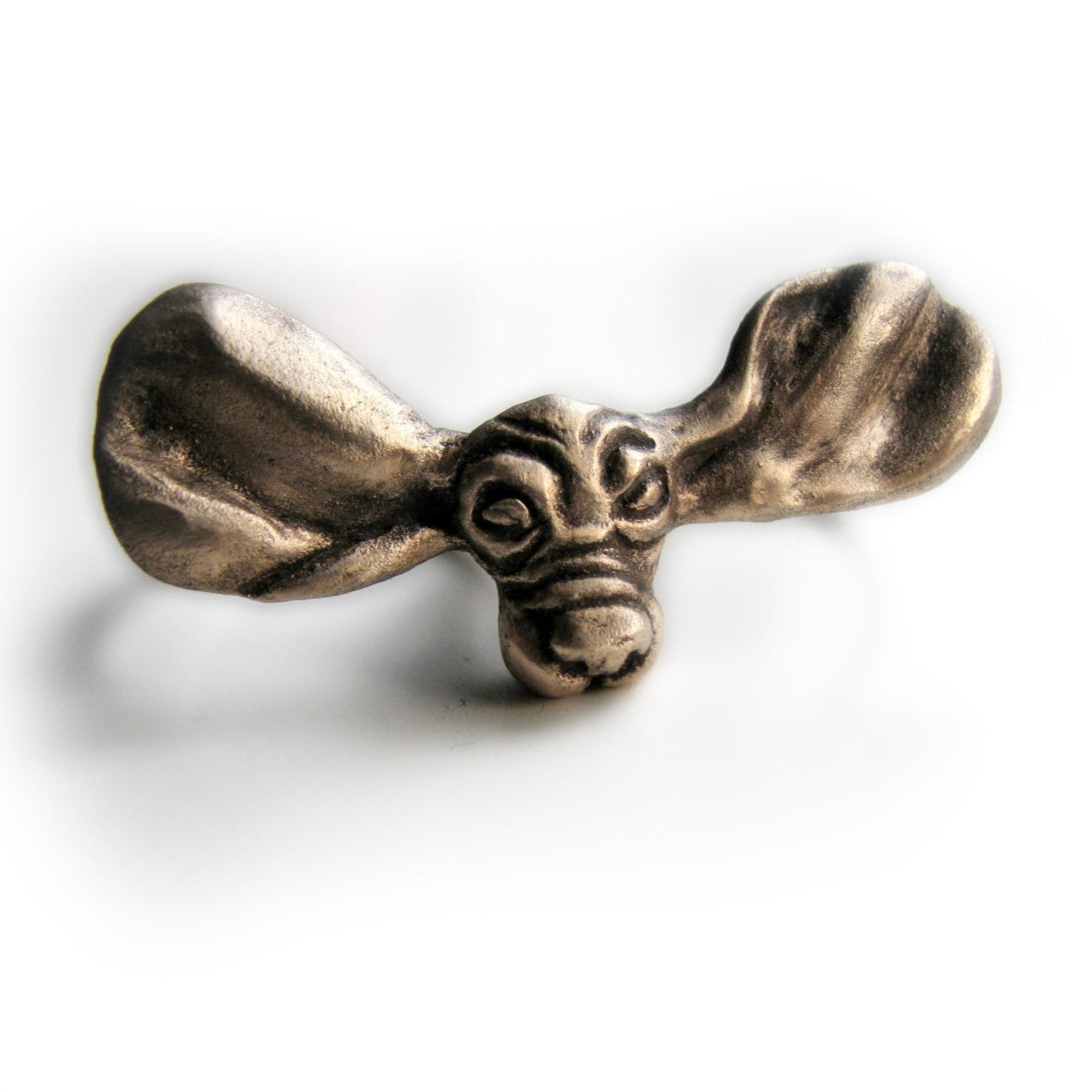 Bronze two-finger ring featuring a whimsical basset dog design with ears cascading over the knuckle.