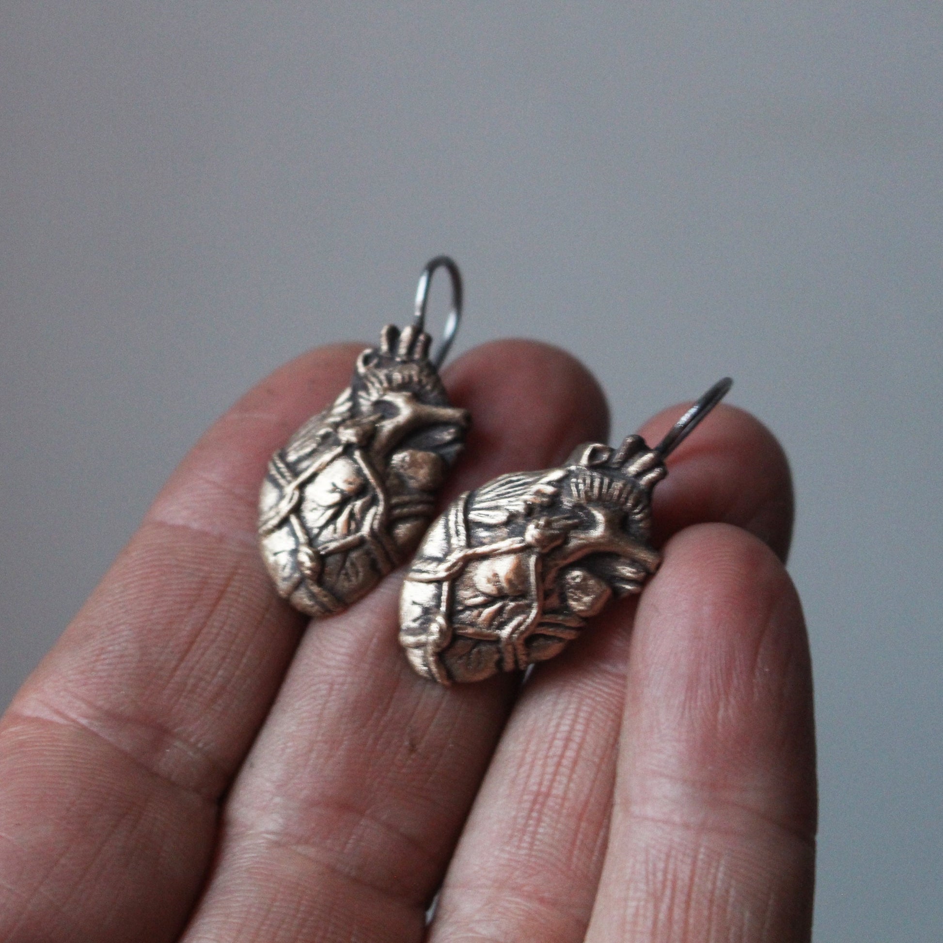 bound heart bdsm titanium earrings