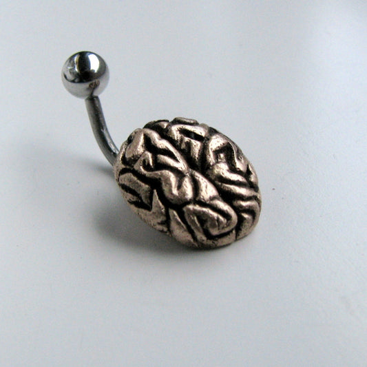 A belly button ring with a bronze sculptured brain design attached to a curved barbell with a steel ball on one end.