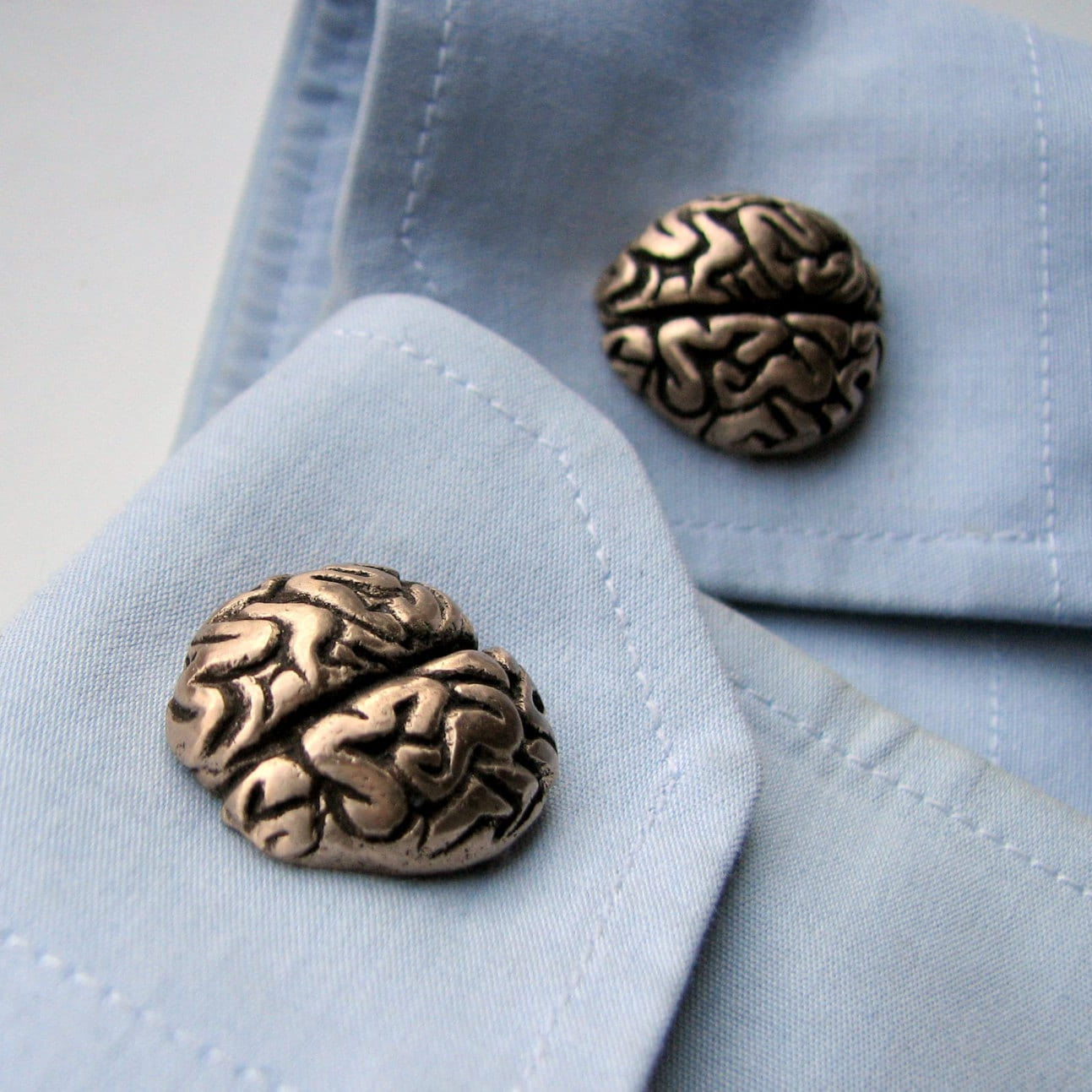 brons hjärnor manschettknappar