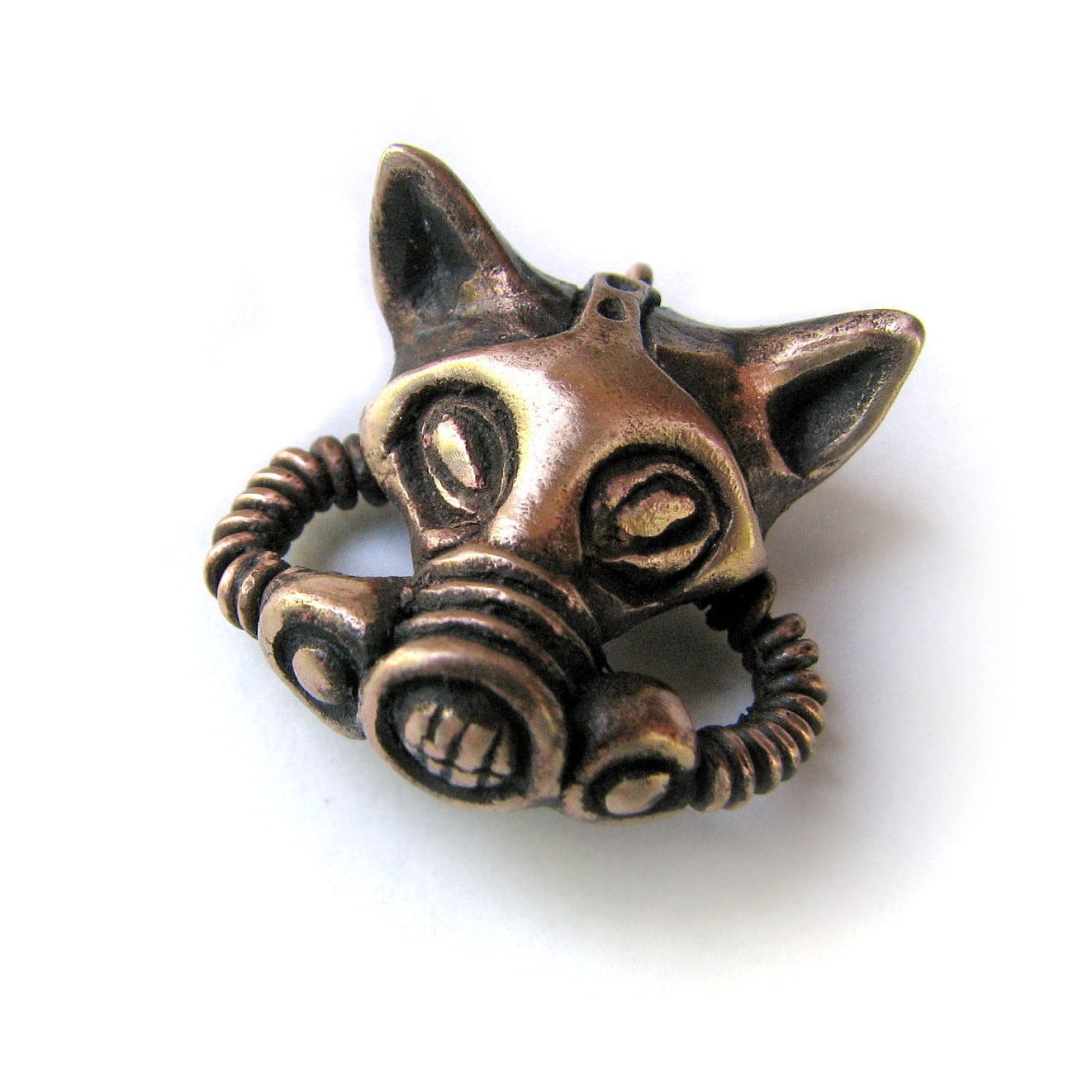 A bronze pendant in the shape of a cat wearing a gas mask.