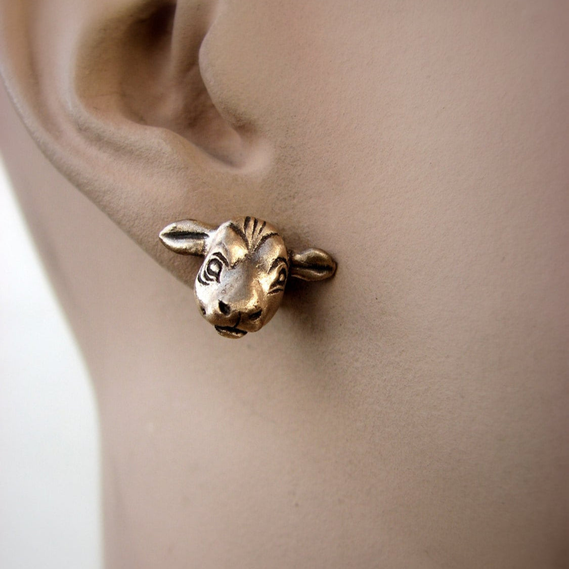 cow head earrings in titanium and bronze