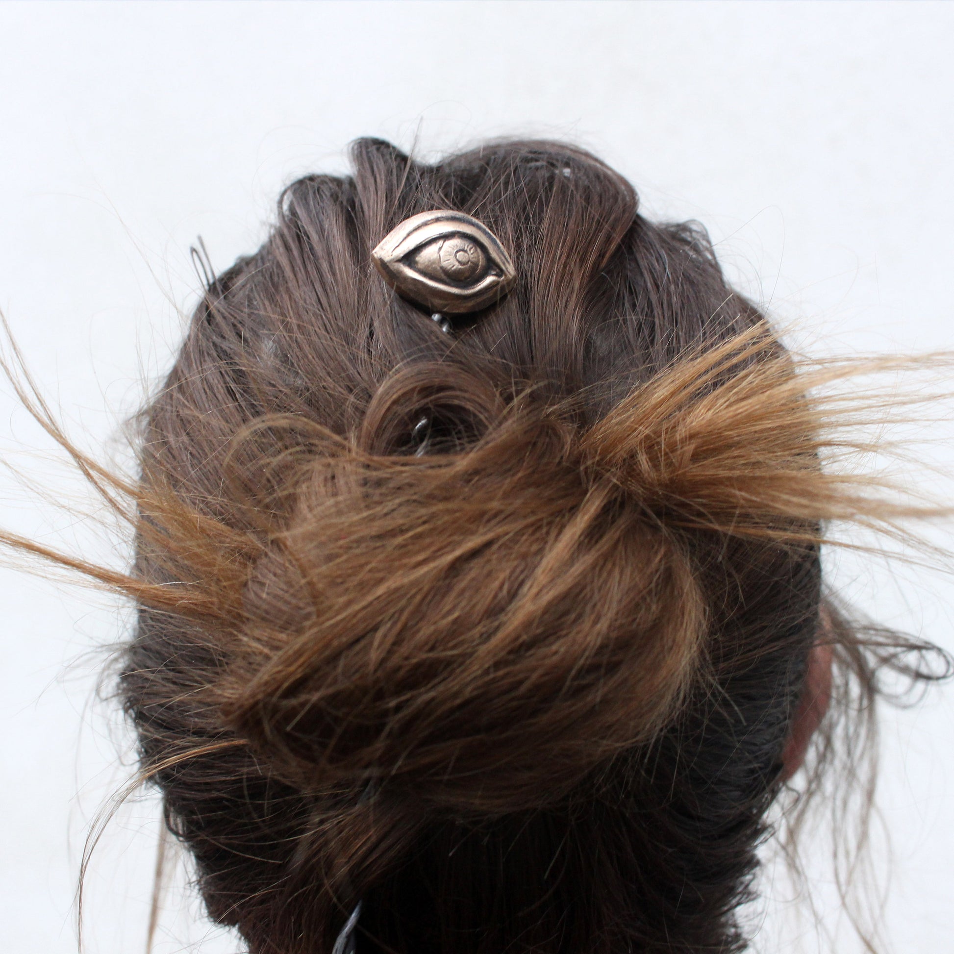 hairjewelry with sculpted human eye