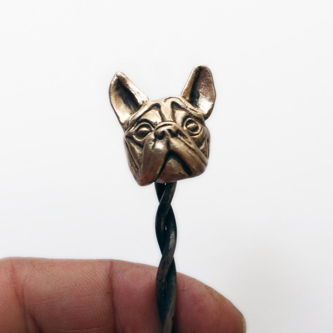 steel hairstick with the head of a french bulldog sculpted in bronze