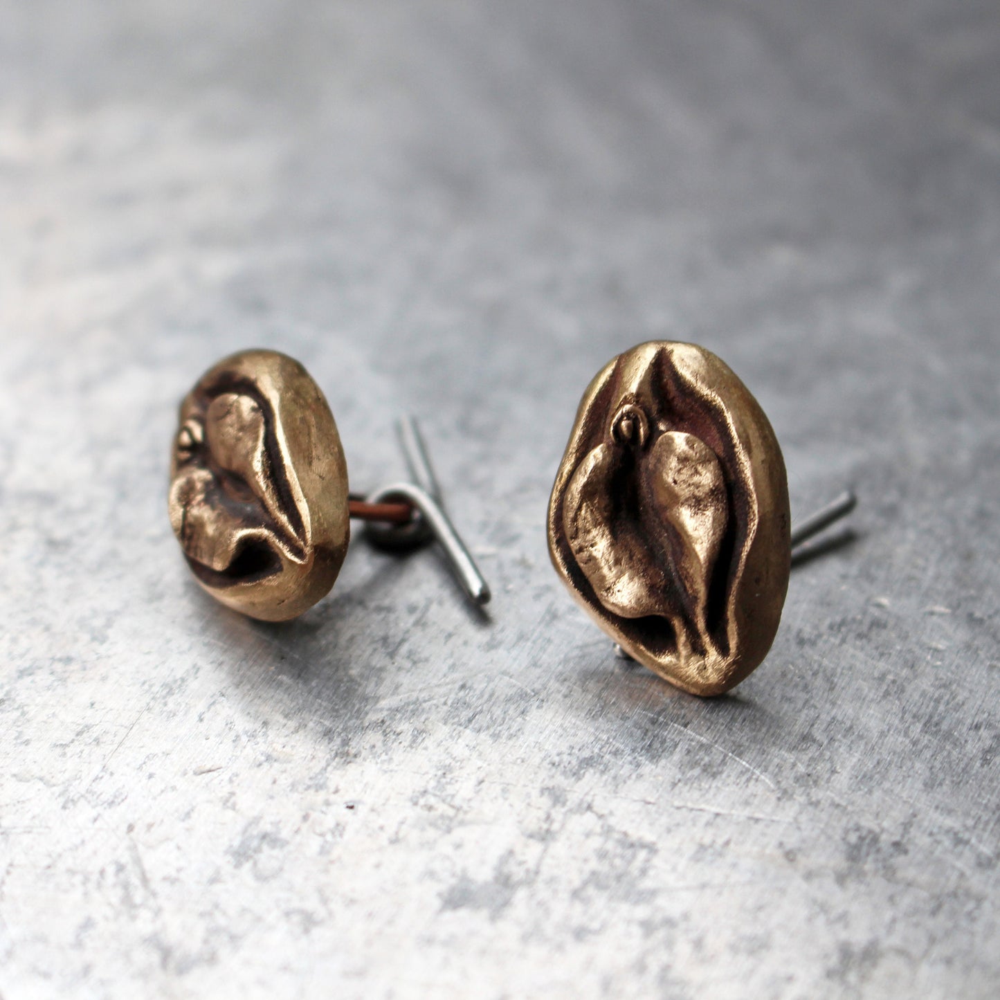 Pussy cuff links. Vagina art