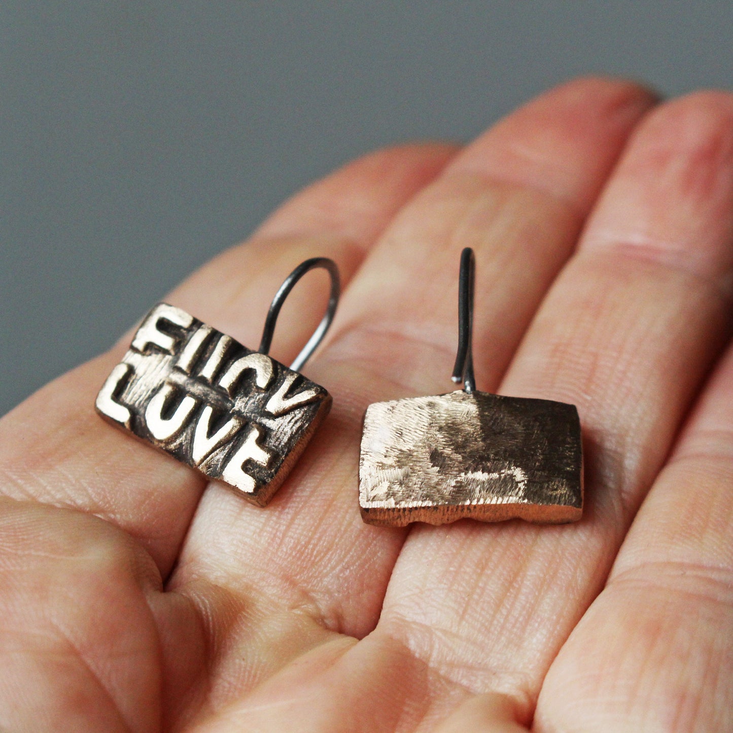 Fuck love earrings