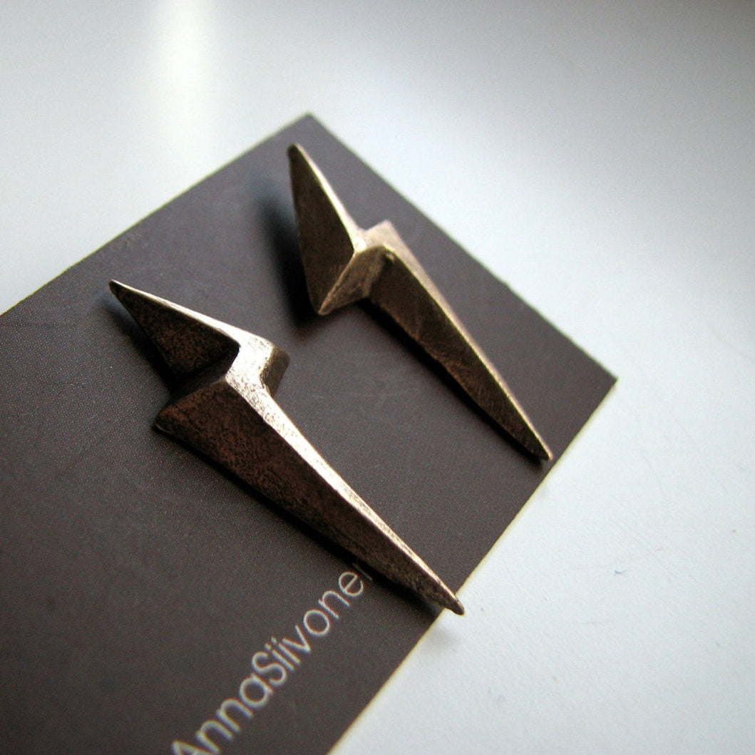 Bronze spike earrings on a brand card with 'AnnaSivone' branding.