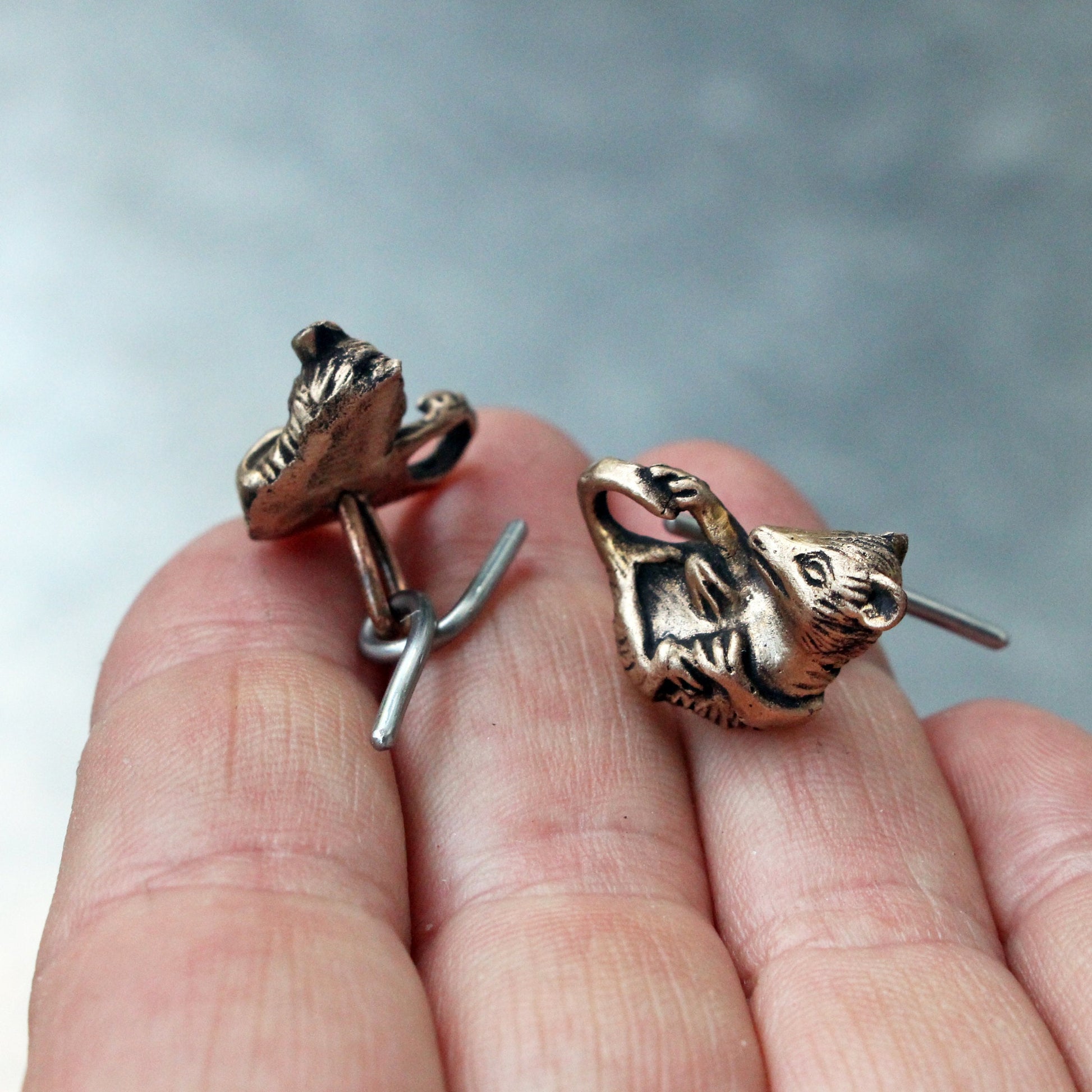 hadgjorda opossum maschettknappar