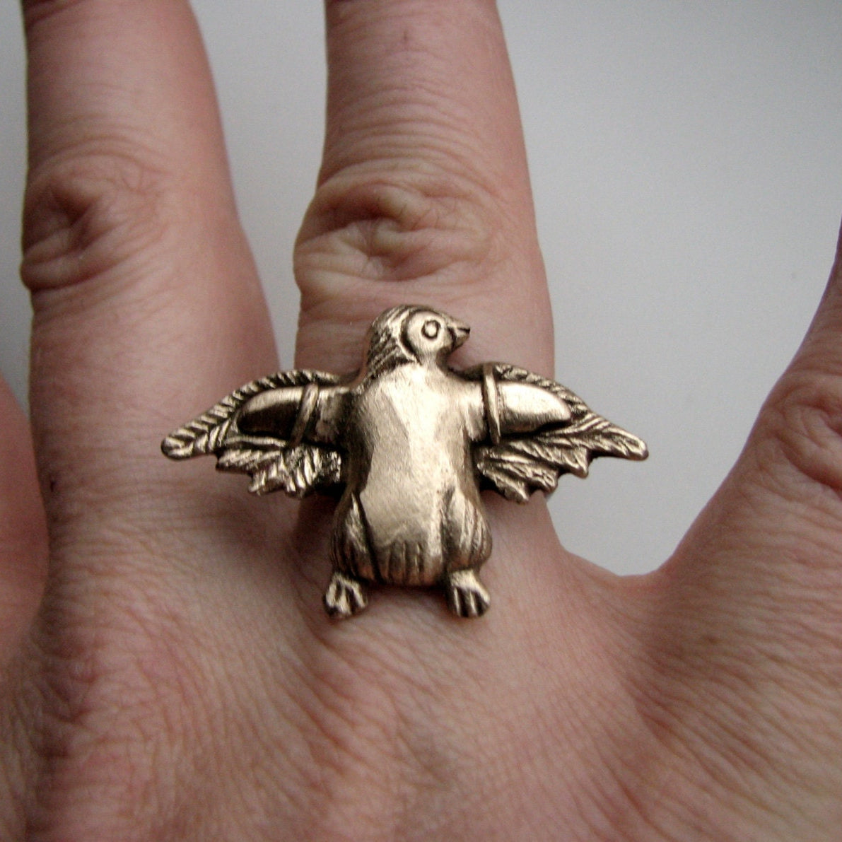 bronze and steel penguin ring, the penguin have extra wings