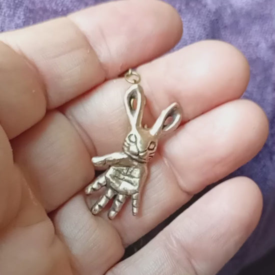 handmade bronze pendant featuring a bunny with a hand for body