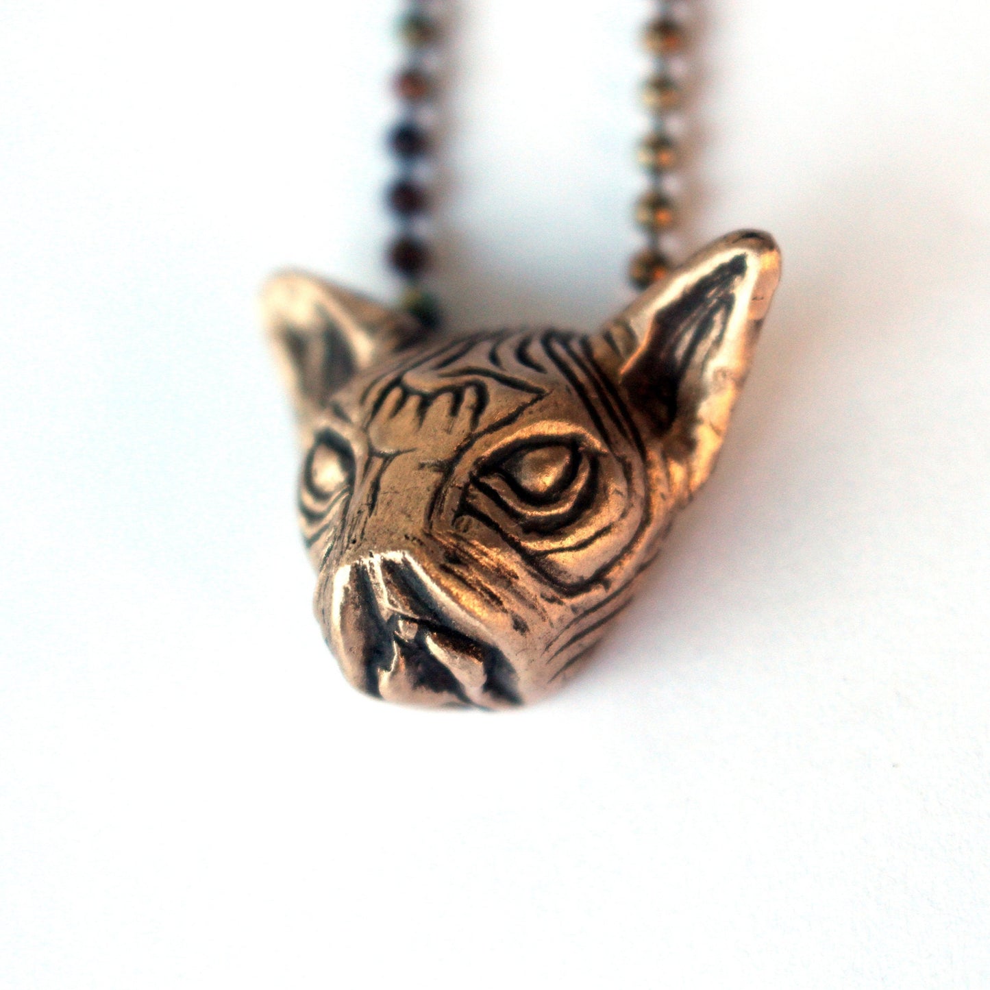 surreal pussy cat pendant