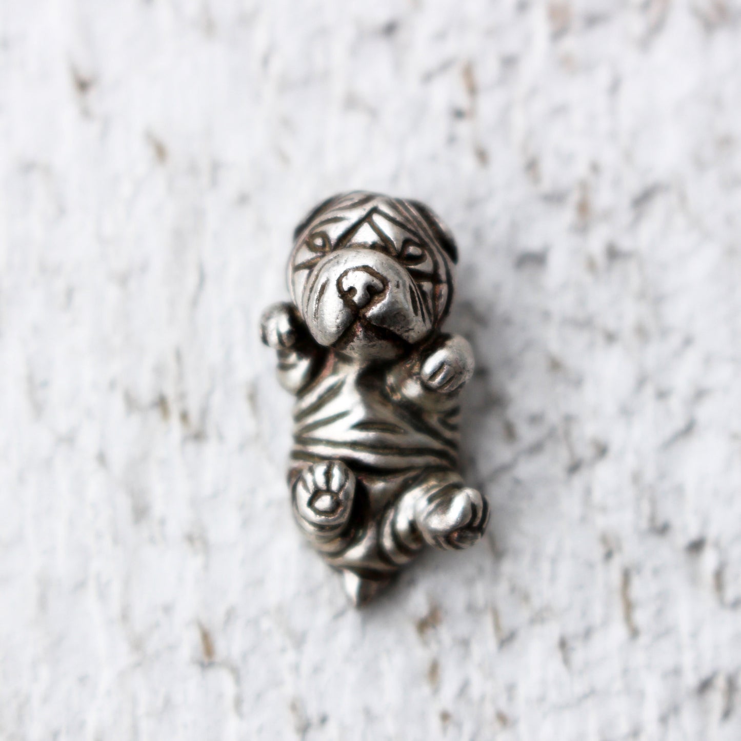 sterling silver necklace featuring a detailed pendant of a wrinkly Shar Pei puppy dog.