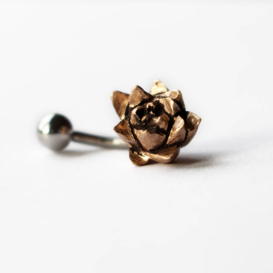 belly button ring with a bronze succulent flower curved barbell made of either titanium or surgical steel.
