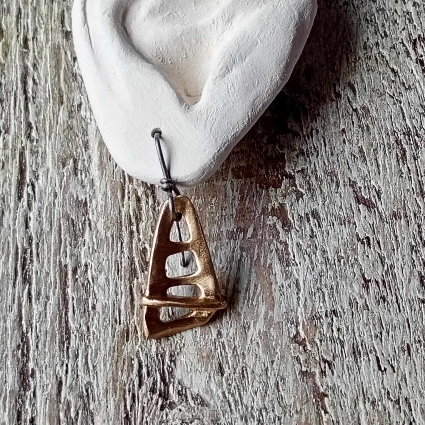 Bronze sailboat earring with allergy safe titanium hooks